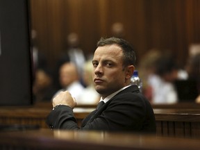 Olympic and Paralympic track star Oscar Pistorius could wait up to four more months to be released from prison after South Africa's justice department delayed his transfer to house arrest that was set for Friday. (Alon Skuy/Reuters/Pool/Files)