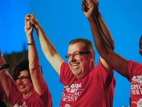 OSSTF president Sam Hammond delivers the work-to-rule marching orders to fellow teachers and is met with multiple standing ovations in support at the Harbour Castle Westin in Toronto on Aug. 20, 2015. (Stan Behal/Toronto Sun)