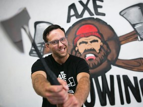 Kallen Saczkowski of Bad Axe Throwing poses for a portrait at one of the companies locations in Ottawa, August 20, 2015.        (Chris Roussakis/ Ottawa Sun Postmedia)