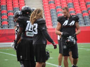 Defensive end Justin Phillips (44) practises with the Ottawa RedBlacks Thursday at TD Place. Phillips, whose wife Jacqueline delivered a baby boy Weston eight weeks premature on Wednesday, is hoping to return to the Ottawa lineup Sunday in Toronto, along with linebacker Travis Brown (43). (TIM BAINES/OTTAWA SUN)