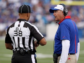 Buffalo Bills head coach Rex Ryan talks to back judge Greg Yette (38) during a stoppage in play against the Carolina Panthers in a preseason game at Ralph Wilson Stadium. (Timothy T. Ludwig/USA TODAY Sports)