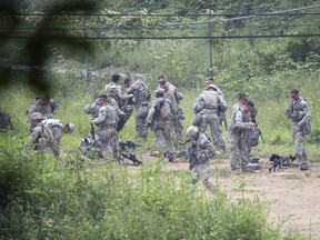 U.S. army soldiers prepare for a military exercise at a training field near the demilitarized zone separating the two Koreas in Pocheon, South Korea, on Aug. 21, 2015. North Korean leader Kim Jong Un ordered his troops onto a war footing from 5 p.m on Friday after his government issued an ultimatum to Seoul to halt anti-Pyongyang propaganda broadcasts by Saturday afternoon or face military action. (REUTERS/Kim Ju-sung/Yonhap)