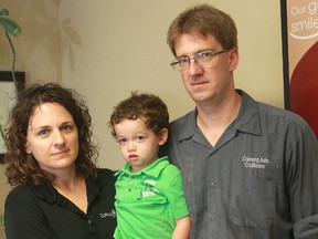 Laurie and Wade McKeen of Cobourg hold their nephew Oscar on Thursday. Oscar and his twin brother John were in Canada with their mother when John developed critical heart problems. The family flew home to Spain on Thursday night.
PETE FISHER/Northumberland Today