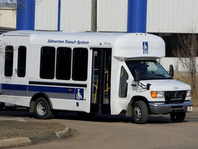 An Edmonton Transit Service DATS bus turns the corner off of 86 Street onto 57 Avenue.