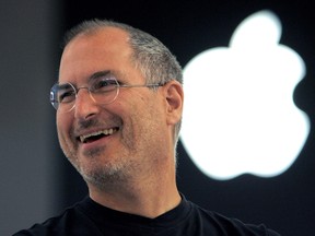 In this Sept. 20, 2005 file photo, Apple co-founder Steve Jobs smiles after a press conference as he opens the Apple Expo in Paris. (AP Photo/Christophe Ena, File)