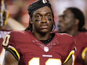 Redskins quarterback Robert Griffin III walks off the field after an injury during first half NFL preseason action against the Lions in Landover, Md., on Thursday, Aug. 20, 2015. (Mark Tenally/AP Photo)