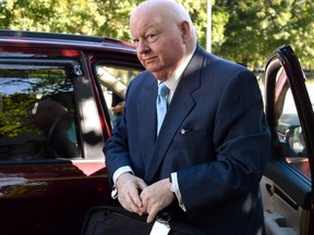 Former Conservative senator Mike Duffy arrives at the courthouse in Ottawa, for the second day of testimony by Benjamin Perrin, former legal adviser for the Prime Minister's Office, on Friday, Aug. 21, 2015. Duffy is facing 31 charges of fraud, breach of trust, bribery, frauds on the government related to inappropriate Senate expenses. THE CANADIAN PRESS/Justin Tang