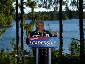 Conservative Leader Stephen Harper speaks to supporters at a campaign stop on the shores of McIvor Lake in Campbell River, B.C., on Friday, August 21, 2015. THE (CANADIAN PRESS/Sean Kilpatrick)
