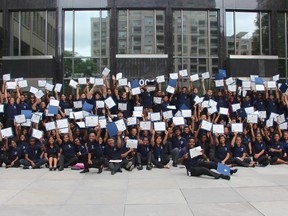 Toronto Police Service Youth in Policing Initiative students pose for a group photo to mark the end of their service in the summer program on Aug. 21, 2015. (Nick Westoll/Toronto Sun)