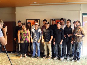 Aboriginal youth who graduated from the line crew ground support training program pose for a group photo following a ceremony at Cambrian College on Friday. Ben Leeson/The Sudbury Star/Postmedia Network