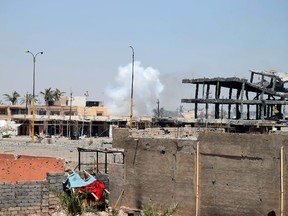 Smoke rises following a U.S.-led coalition airstrike against Islamic State group positions during a military operation in Anbar province, Iraq on Saturday, Aug. 15, 2015. The White House said Friday the No. 2 leader of the Islamic State militant group was killed in a U.S. military airstrike in Iraq. (AP Photo)