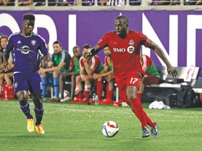 Jozy Altidore (right), playing against Orlando City on the road earlier this season, could start on the bench as TFC alters its defensive schemes for today’s tilt. (USA Today Sports)