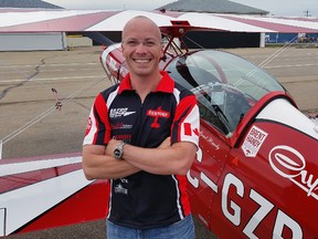 Brent Handy, an active duty Royal Canadian Air Force (RCAF) CF-18 pilot and former Snowbird lead, poses for a photo in front of his Pitts Special aircraft at the Villeneuve Airport on Friday, August 21, 2015. Trevor Robb/Edmonton Sun/Postmedia Network