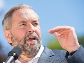 NDP Leader Thomas Mulcair speaks to supporters during a federal election campaign stop in Saint Jerome, Que., on Saturday, August 22, 2015. THE CANADIAN PRESS/Graham Hughes