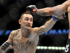 Max Holloway (pictured) will take on Charles Oliveira in the main event at UFC Fight Night 74 in Saskatoon on Sunday. (Jonathan Nackstrand/AFP/Files)