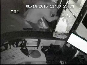 Video surveillance showing the suspect and the broken window in the door. RCMP handout