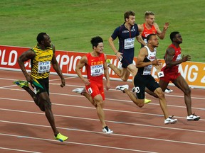 (L-R) Usain Bolt of Jamaica, Su Bingtian of China, Christophe Lemaitre of France, Andre De Grasse of Canada, Julian Reus of Germany (back) and Trayvon Brommell of the U.S. compete in the men's 100 metres semi-final at the 15th IAAF World Championships at the National Stadium in Beijing, China August 23, 2015.  REUTERS/David Gray