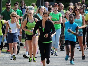 Sereena Nahmabin leads runners and walkers in a 5k in memory of her friend Kailee Kavanaugh Sunday at Canatara Park. It's estimated about 200 people took part. Tyler Kula/Sarnia Observer/Postmedia Network