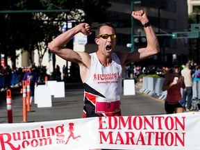 Tom McGrath wins the Edmonton Marathon, in Edmonton Alta. on Saturday Aug. 23, 2015. David Bloom/Edmonton Sun/Postmedia Network