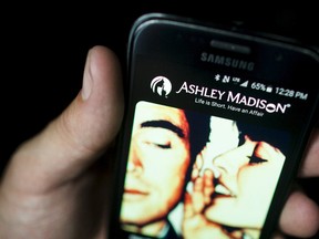 Mark Blinch/Reuters
A photo illustration shows the Ashley Madison app displayed on a smartphone in Toronto on Thursday. Love lives and reputations may be at risk after the release of customer data from the infidelity website.