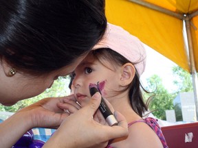 Paisley Lauzon, 2, has her face painted at the Canadian Garlic Festival in Sudbury in this file photo. Ben Leeson/The Sudbury Star/Postmedia Network
