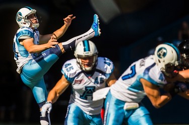 Toronto Argonauts kicker Swayze Waters punts the ball against the Ottawa RedBlacks during the first half of CFL football action in Toronto, Sunday August 23, 2015. THE CANADIAN PRESS/Mark Blinch