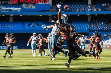 Toronto Argonauts Vidal Hazelton can't catch a ball with coverage from Ottawa RedBlacks Jacques Washington during the first half of CFL football action in Toronto, Sunday August 23, 2015. THE CANADIAN PRESS/Mark Blinch