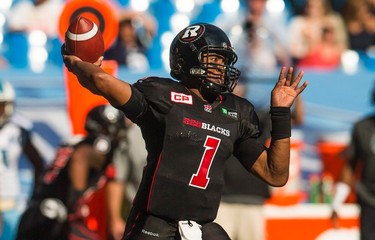 Ottawa RedBlacks' quarterback Henry Burris throws the ball against the Toronto Argonauts during the first half of CFL football action in Toronto, Sunday, August 23, 2015. THE CANADIAN PRESS/Mark Blinch