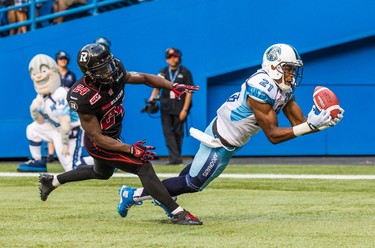 Toronto Argonauts' Vidal Hazelton, right, catches a touchdown pass against Ottawa RedBlacks' Jerrell Gavins during the second half of CFL football action in Toronto on Sunday, August 23, 2015. THE CANADIAN PRESS/Mark Blinch