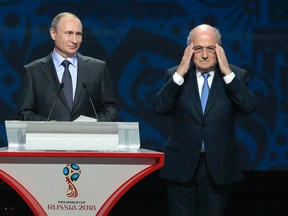 FIFA President Sepp Blatter and Russian President Vladimir Putin during the preliminary draw for the 2018 soccer World Cup in Konstantin Palace in St. Petersburg, Russia, Saturday, July 25, 2015. (AP Photo/Ivan Sekretarev)