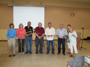 Phrag fighters. From left to right: Dr. Janice Gilbert, Nature Conservancy Canada and Ontario Phragmites Working Group; Kate Monk, Ausable Bayfield Conservation Authority; Al Williamson, Williamson Farms; Don McCabe, President, Ontario Federation of Agriculture; Ken Vegh, Municipal Drainage & Inspection Supervisor, Town of Kingsville; Mayor Bill Weber, Lambton Shores; Nette Pachlarz, Director, Lambton Shores Phragmites Community Group; Nancy Vidler, Chair, LSPCG. One stem of Phragmites can grow to more than three metres in height and send out several new runners from its stem. (photo – Bill MacDonald)