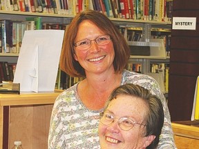 Connie Clement, Vulcan’s new librarian, stands beside Dorothy Way, assistant librarian. Clement would like to carry on the partnerships and programs put forth by former librarian Kim Armstrong, who recently left. Derek Wilkinson Vulcan Advocate