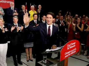 Justin Trudeau waves to a crowd of supporters during a stop at the Quinte Sports and Wellness Centre, on Monday August 24, 2015 in Belleville, Ont. Emily Mountney-Lessard/Belleville Intelligencer/Postmedia Network