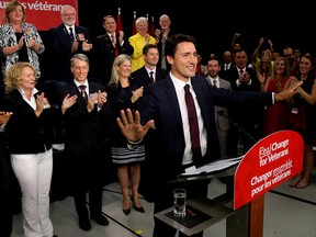 Justin Trudeau waves to a crowd of supporters during a stop at the Quinte Sports and Wellness Centre, on Monday August 24, 2015 in Belleville, Ont. Emily Mountney-Lessard/Belleville Intelligencer/Postmedia Network