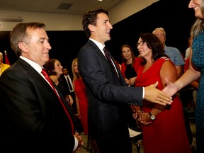 Justin Trudeau, with Bay of Quinte Liberal candidate Neil Ellis, greets supporters during a stop at the Quinte Sports and Wellness Centre, on Monday August 24, 2015 in Belleville, Ont. Emily Mountney-Lessard/Belleville Intelligencer/Postmedia Network