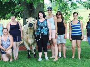 European delegates participating in the Junior Farmers International Exchange Program toured local farms during their two weeks in Perth and Huron Counties. From left to right: Amanda Brodhagen (Perth JF member), Jacquelyn Denham (Perth JF member), Gillian Steward (Scotland), Lisa-Marie Walsh (Republic of Irerland), Lana Kraus (Perth JF Member), Tipsy (show heifer), Crystal Blake (Perth JF President and farm host), Carolin Westerkamp (Germany), Beatrice Hadorn (Switzerland), Christina Poganitsch (Austria), and Jennifer Butson (Perth JF member). SUBMITTED