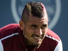 Nick Kyrgios, of Australia, awaits a serve from John Isner, of the United States, during play at the Rogers Cup in Montreal on August 13, 2015. (THE CANADIAN PRESS/Paul Chiasson)