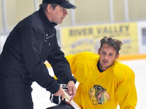 Under the guidance of coach Duane Harmer (above, left), the Mitchell Jr. C Hawks opened their 2015-16 training camp last week in St. Marys. Also pictured is defenceman Zach Goodhew. ANDY BADER/MITCHELL ADVOCATE