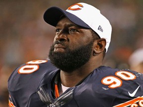Jeremiah Ratliff of the Chicago Bears watches from the sidelines as his teammates take on the Miami Dolphins during a preseason game at Soldier Field on August 13, 2015.  (Jonathan Daniel/AFP)