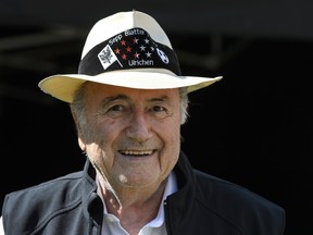 Outgoing FIFA president Sepp Blatter smiles during the "Sepp Blatter Tournament" on August 22, 2015 in Ulrichen, Blatter's hometown. When Blatter was elected FIFA President in 1998, the town awarded him with the "honorary burgher" of Ulrichen title and to commemorate the occasion, a football tournament bearing his name was created. (AFP PHOTO/FABRICE COFFRINI)