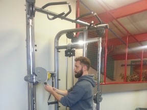 Total Works Health & Fitness Centre located at the Omniplex has a new manager, Grant Turner. Pictured here is Turner setting up a dual adjustable pulley machine.