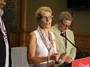 Ontario Premier Kathleen Wynne tackles media questions on teacher negotiations, high occupancy toll lanes and her involvement in federal campaign on Monday Aug. 24, 2015. (ANTONELLA ARTUSO/Toronto Sun)