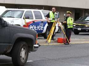 Greater Sudbury Police Services officers investigate a collision where a 7-year-old girl was struck by a truck on Brady Street in Sudbury, Ont. on Monday August 24, 2015. Gino Donato/Sudbury Star/Postmedia Network