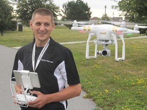 Jeff Reitzel operates one of his drones in a park near his home in Kingston on Monday. He started up his own drone business in the spring and provides still and video photography at local events. (Michael Lea/The Whig-Standard)