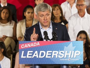 Canada's Prime Minister Stephen Harper speaks during a campaign stop at the WaterStone Estate and Farms in King Township, Ontario, August 20, 2015.  Harper announced policies that would provide tax relief for adoptive families if he is re-elected in the federal election on October 19.    REUTERS/Mark Blinch