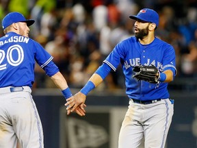 Blue Jays general manager Alex Anthopoulos (inset) has made many big moves this season, but none may have been more important than bringing Josh Donaldson (left) to Toronto. He and slugger Jose Bautista have clicked since the get-go. (Getty Images/AFP)