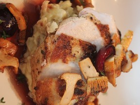 Thyme Roasted Chicken Breast, Sauteed Chanterelles, Quick Pickled Cherries, Bacon & Shallot Smashed Potatoes. Photo by Paul Shufelt