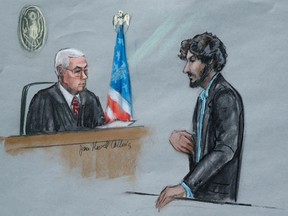 In this June 24, 2015, file courtroom sketch, Boston Marathon bomber Dzhokhar Tsarnaev, right, stands before U.S. District Judge George O'Toole Jr. as he addresses the court during his sentencing, in federal court in Boston. He is now detained in the highest-security prison in the U.S. Penitentiary in Florence, Colo., after being sentenced to death in June. (Jane Flavell Collins via AP, File)