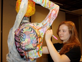 SARAH HYATT/THE INTELLIGENCER
Emily Terpstra, 17, stands beside her piece for the Love My Life Tobacco-Free Art project, at The Core, in Belleville. The opening gala is Wednesday from 6-8 p.m.
