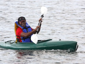 Sushee Perumal, the CEO of MaxSold, kayaks from his home in Barriefield Village on Tuesday to downtown Kingston while the Lasalle Causeway is closed for repairs. (Ian MacAlpine/The Whig-Standard)